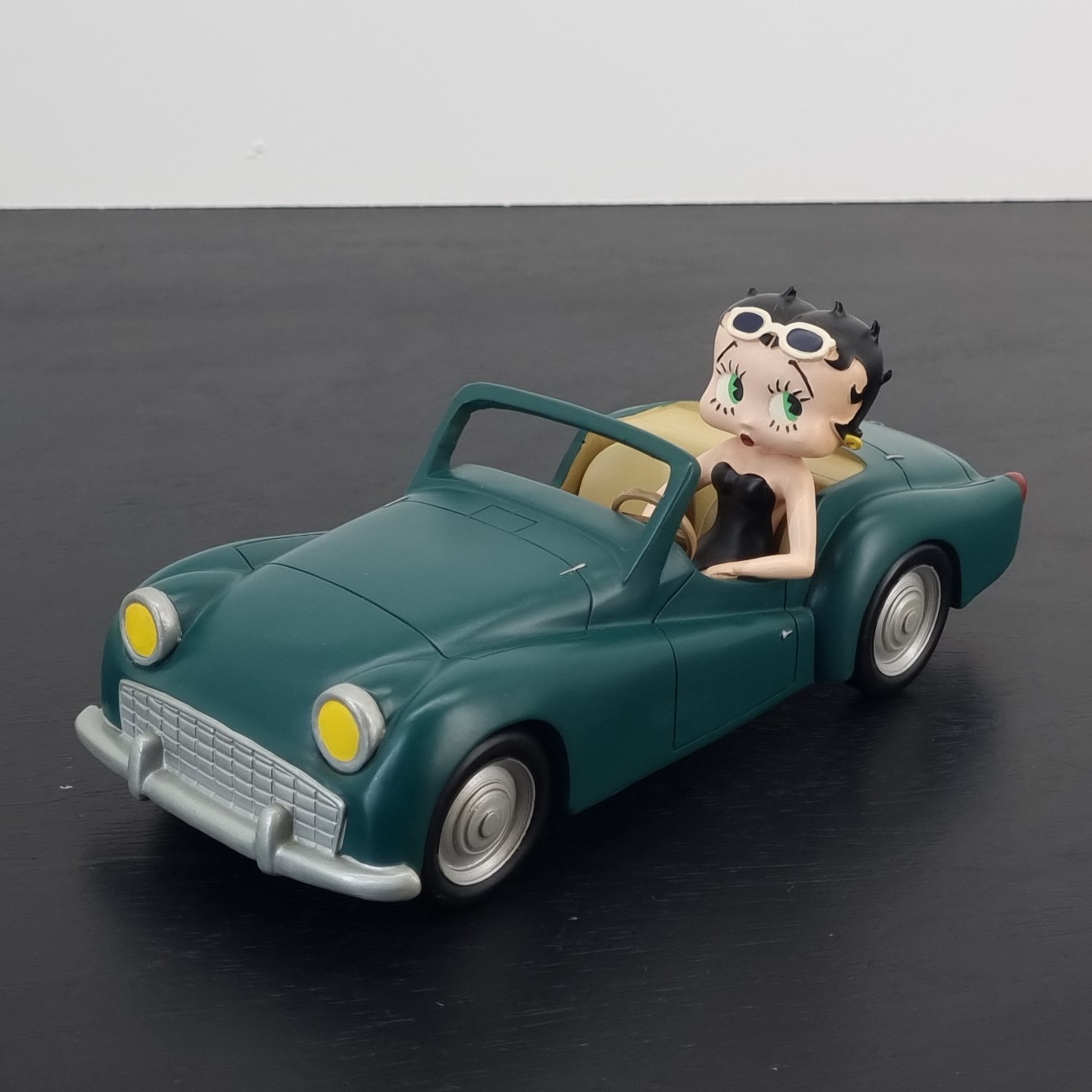 Betty Boop in a green car figurine