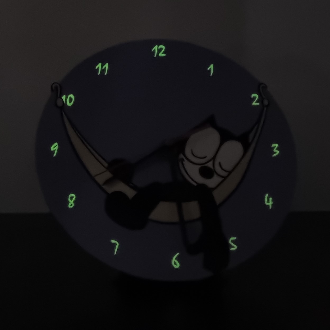 Felix the Cat in a hammock glow in the dark clock