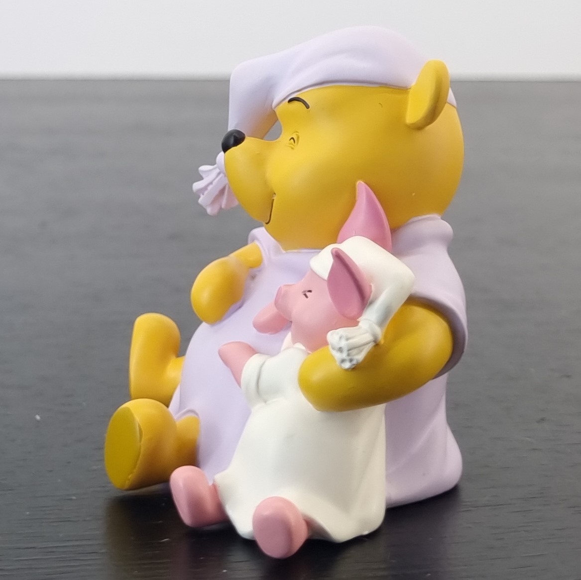 Winnie the Pooh and Piglet sleeping together figurine _left