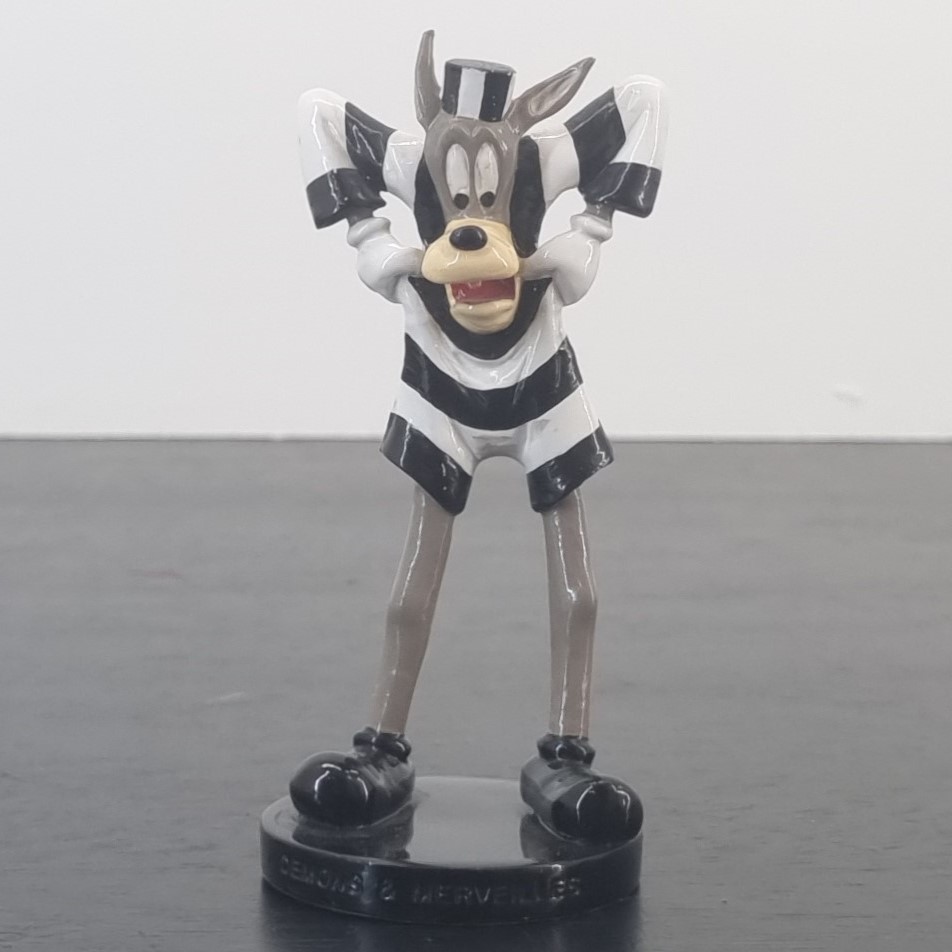 Metal figurine of Wolf Tex Avery dressed in prison clothes