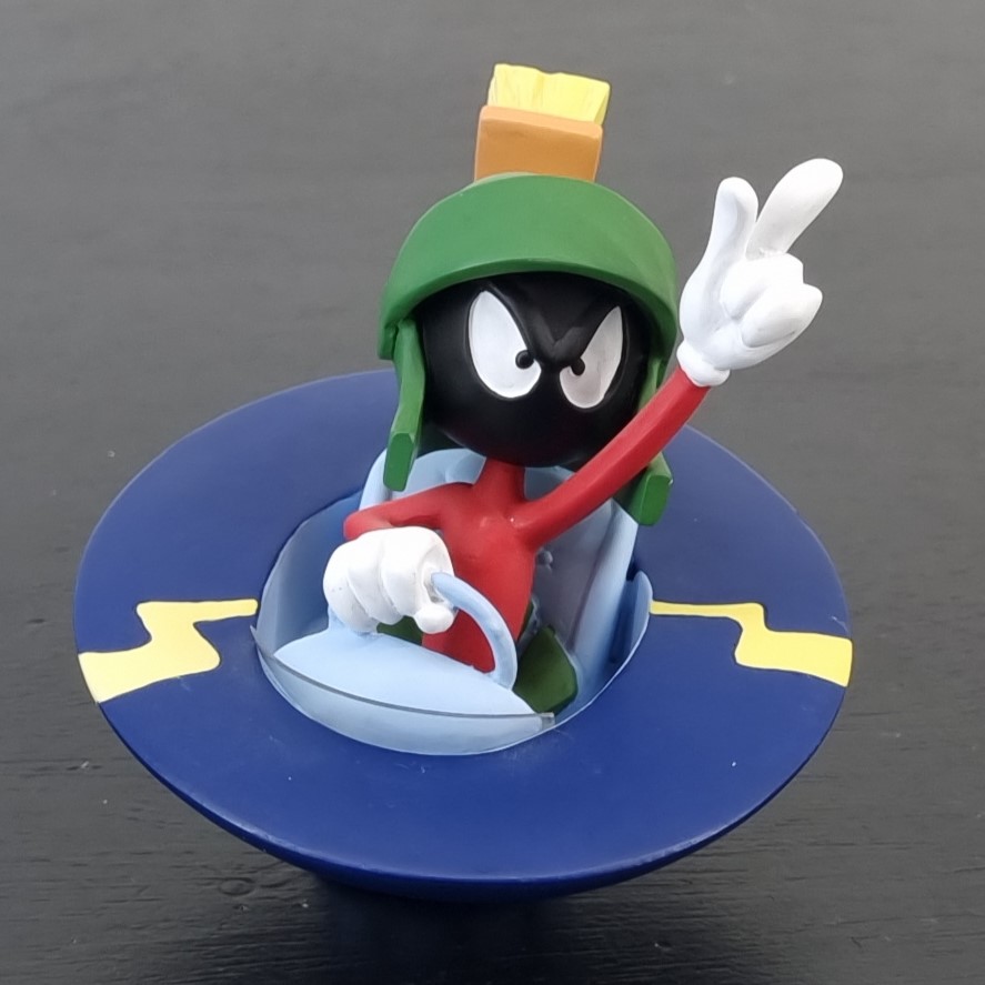 Marvin the Martian flying his UFO figurine