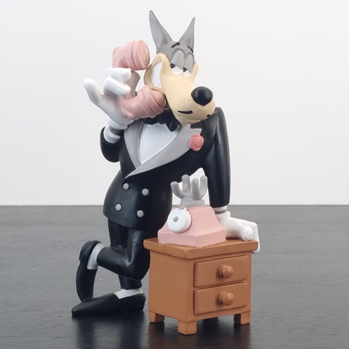 Wolf on the phone figurine