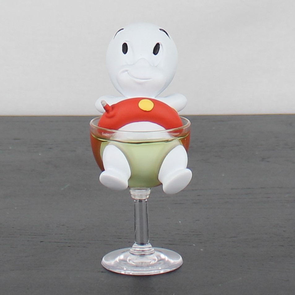 Casper the friendly ghost relaxing in a glass figurine _front