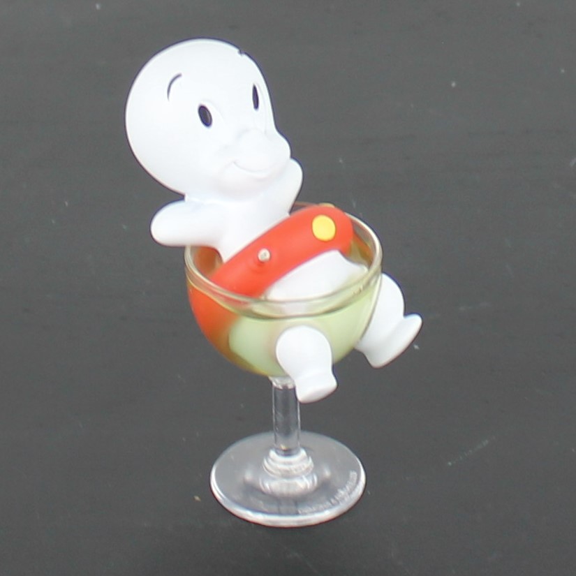 Casper the friendly ghost relaxing in a glass figurine