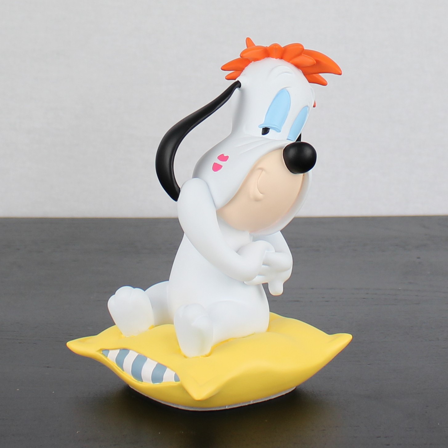 Droopy on a yellow pillow figurine