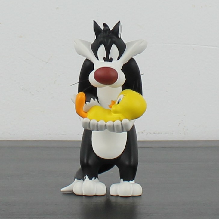 Sylvester the Cat holding Tweety Bird figurine