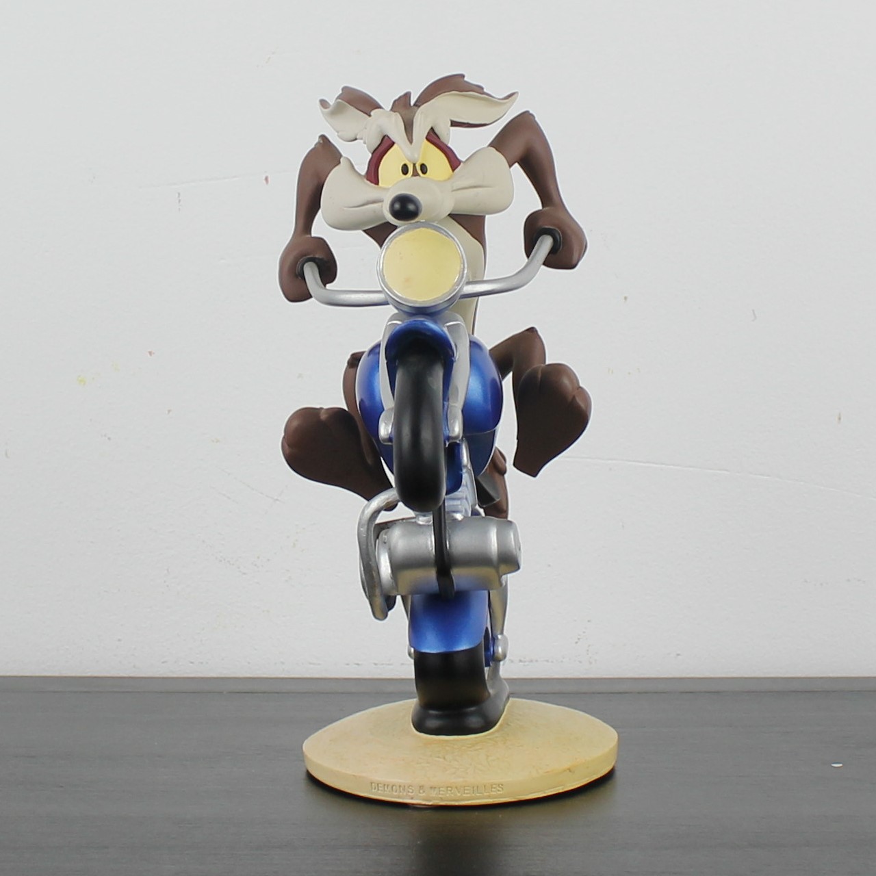 Wile E Coyote riding a motorcycle statue _front