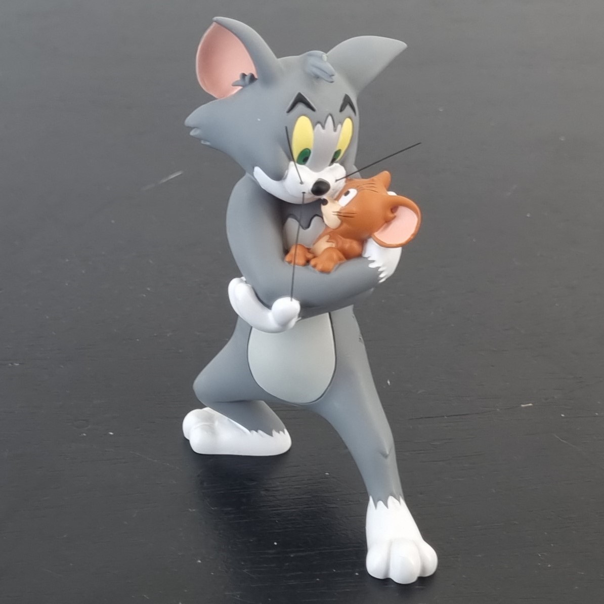 Tom hugging Jerry figurine